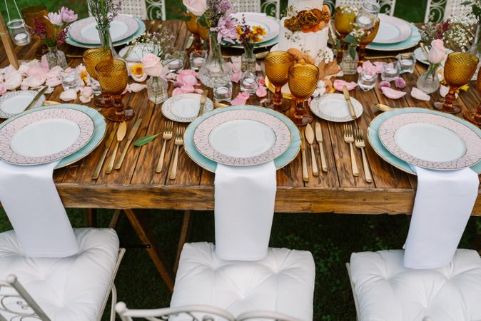 Wedding table decoration in rustic style placed outdoors