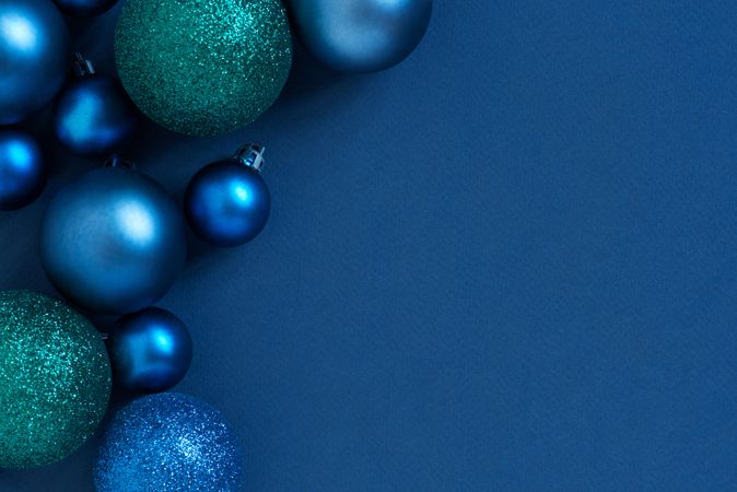 Blue holiday baubles with copy space