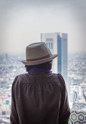 Japan - May, 10 2013: Anonymous person looking at modern city