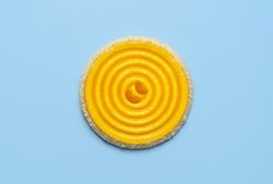 Tangerine cake isolated over blue background