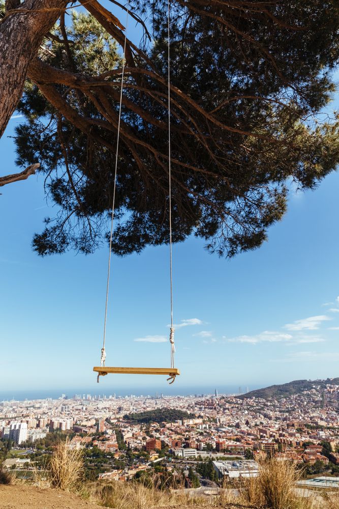View of the city from a swing