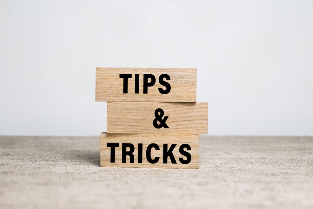tips and tricks words on wooden blocks on neutral background