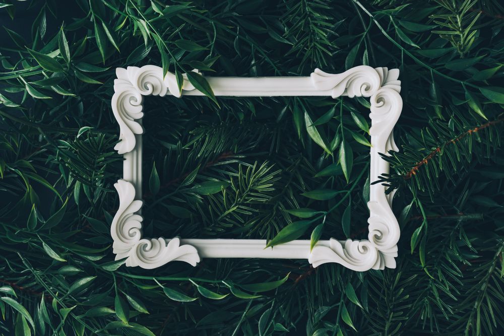 Picture frame immersed in densely packed leaves