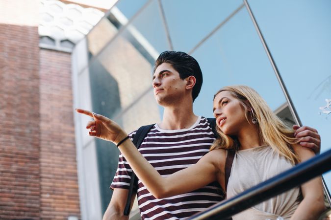 Young tourists couple standing outdoors