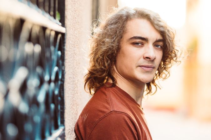 Positive handsome man smiling on street