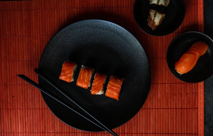 Salmon and eel sushi served on stone slate