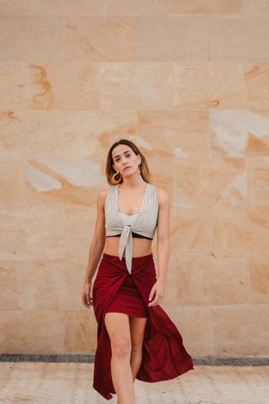 Stylish female resting on town street
