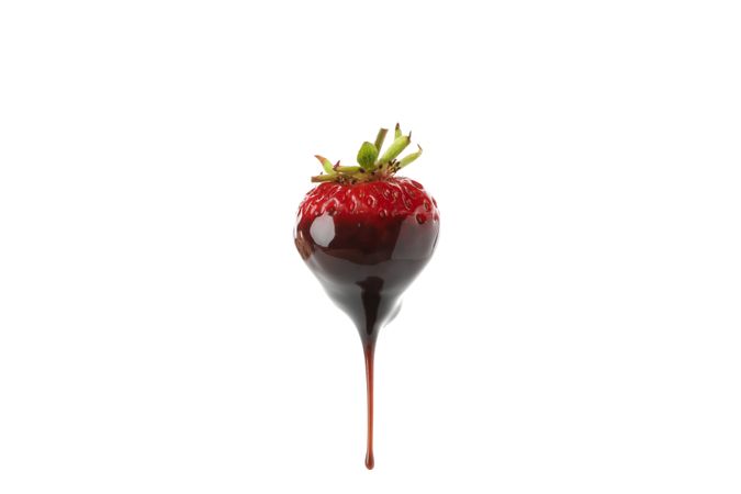 Chocolate fondue. Strawberry in chocolate sauce isolated on plain background