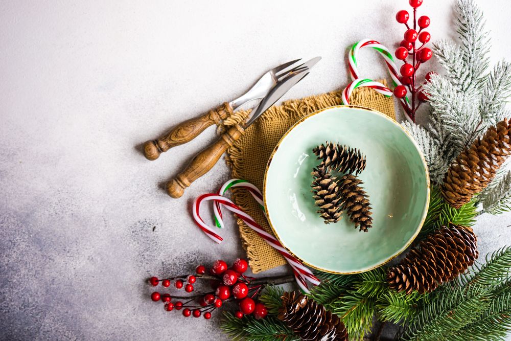 Top view of pine cones in green wintry plate