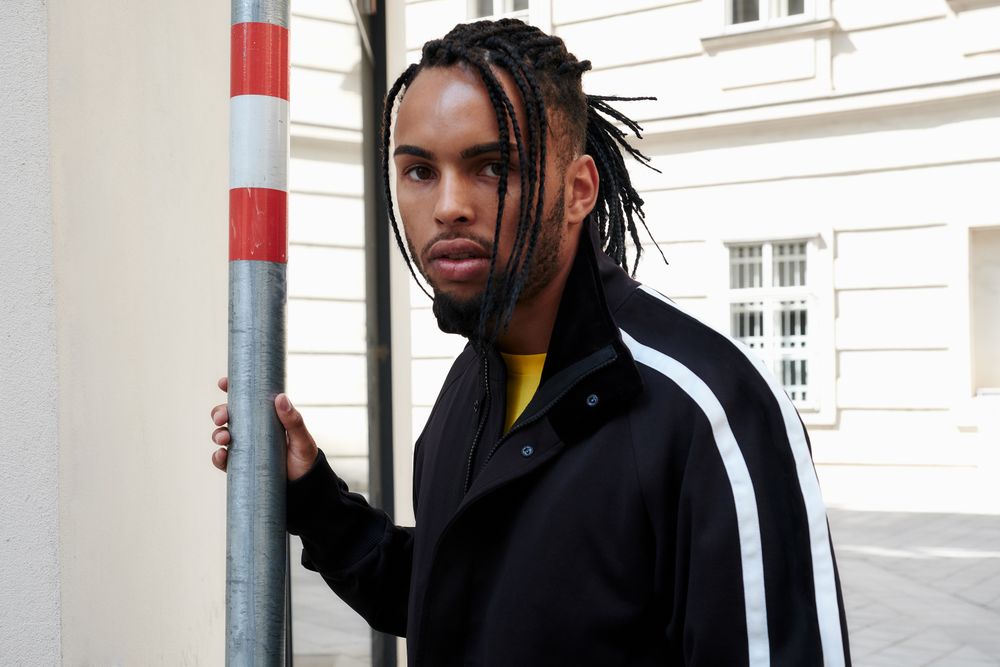 Black male standing outside