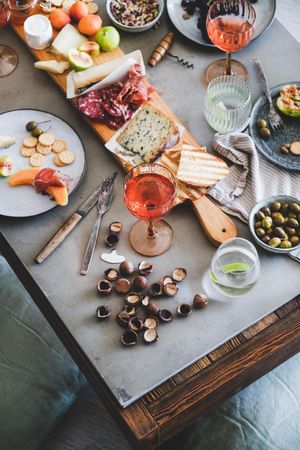 Charcuterie, with wine, cheese, hazelnuts, prosciutto, melon