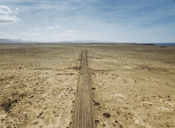 Car driving on road in picturesque desert