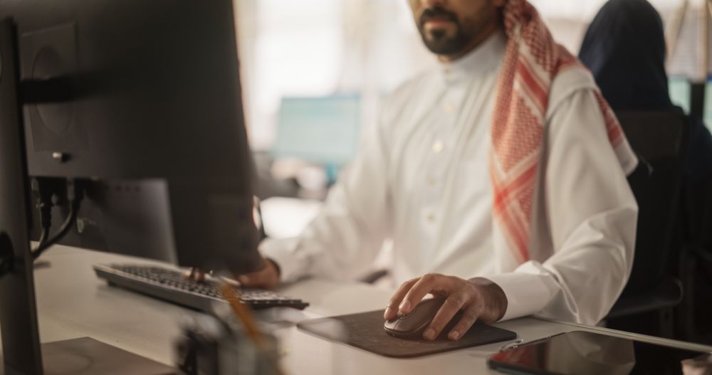 Close Up of a Arab Market Financial Analyst Working in a Research and Development Facility on a Desktop Computer.