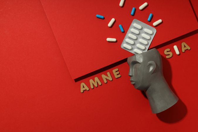 Bust with pills and the words “Amnesia” with space for text