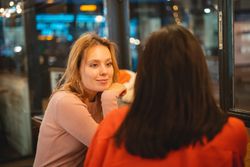 Multiethnic friends talking in cafe