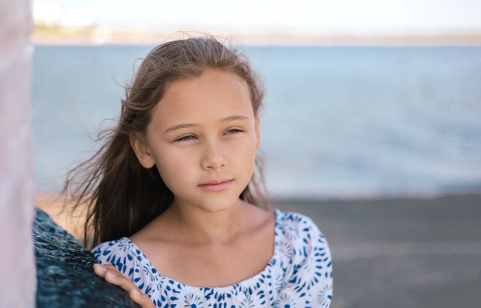 Serious of cute little girl standing thoughtfully