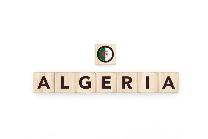 Wooden blocks bearing the name and flag of Algeria.