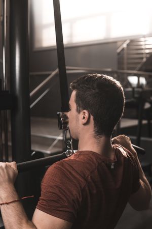 Young fitness man training in gym