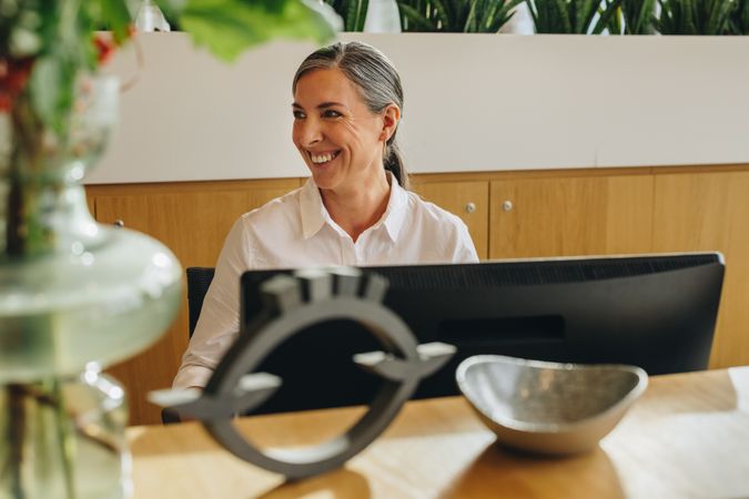 Smiling woman working at desk