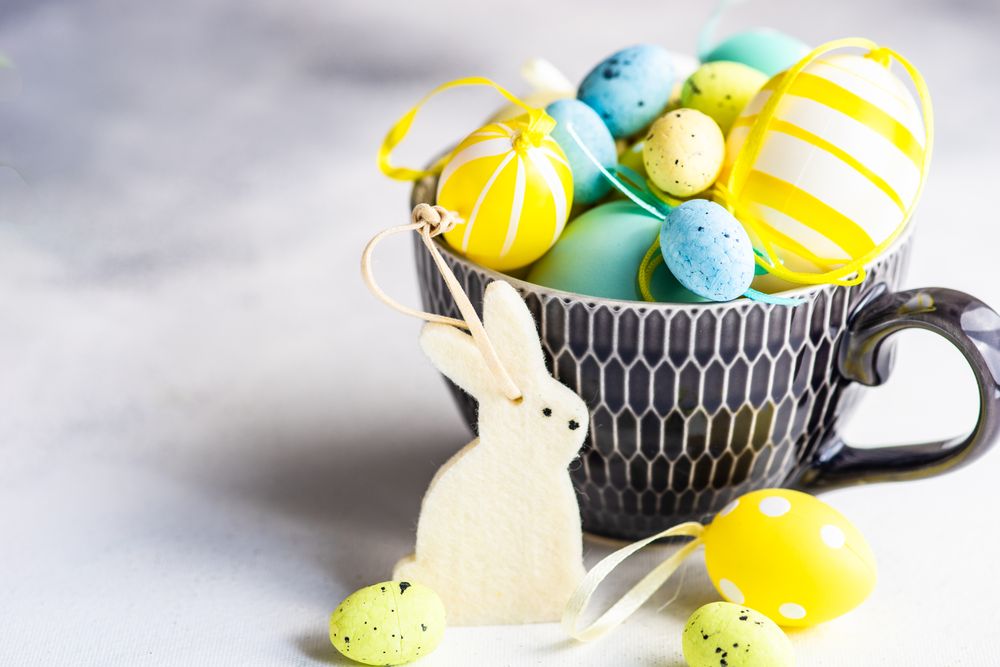 Cup of decorative eggs with rabbit ornaments