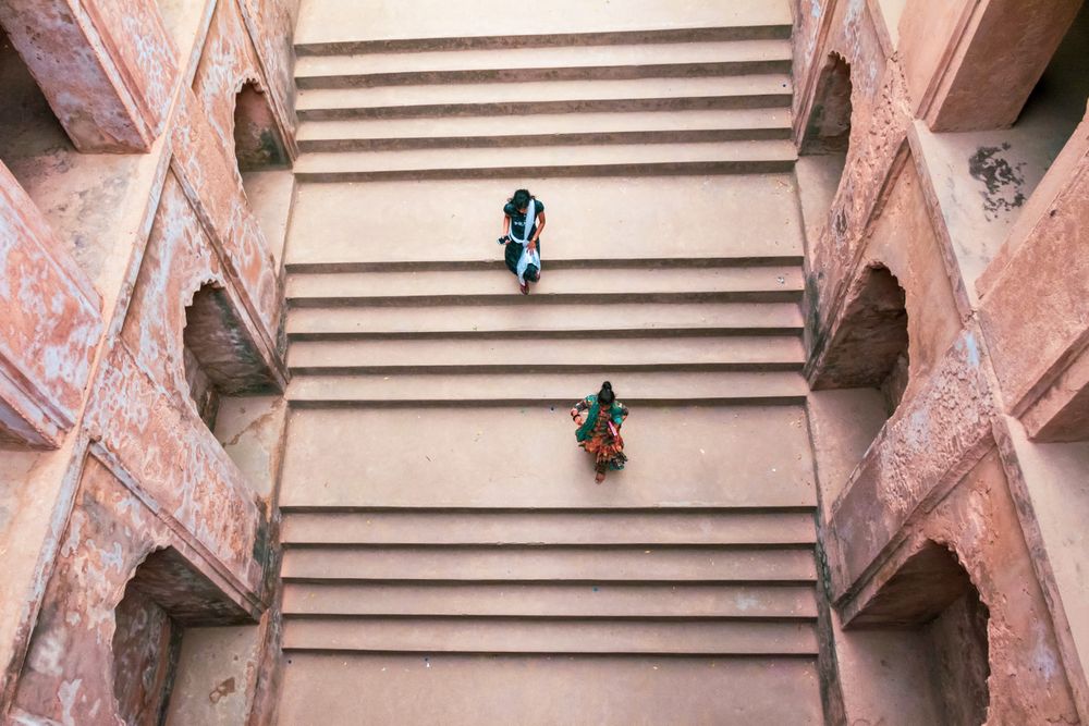 Top view of two girls walking on stepwell in Bara Imambrara, Lucknow, Uttar Pradesh, India