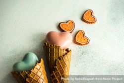 Two ceramic hearts in waffle cones on grey background sugar cookies 47mmVO