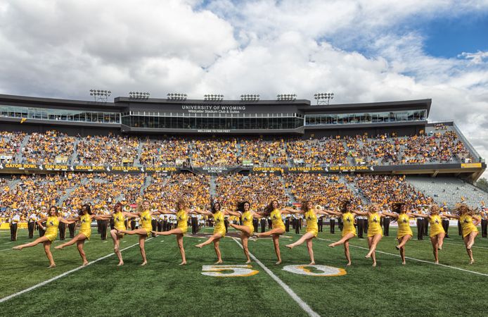 Marching and cheerleaders on football pitch at the University of Wyoming, Laramie, Wyoming