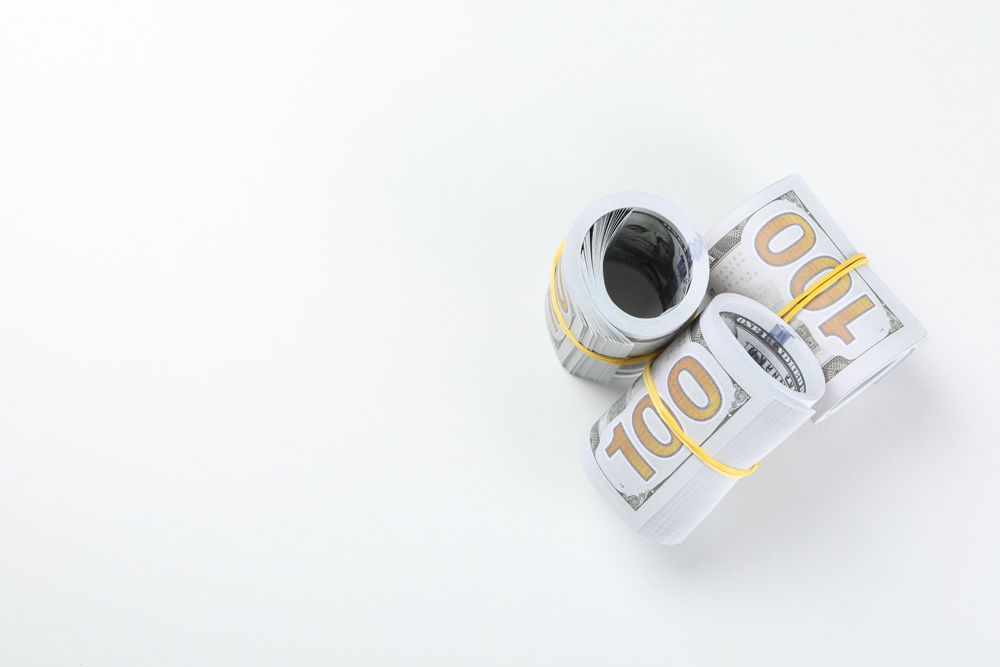 Stacks of American cash money on light background, space for text