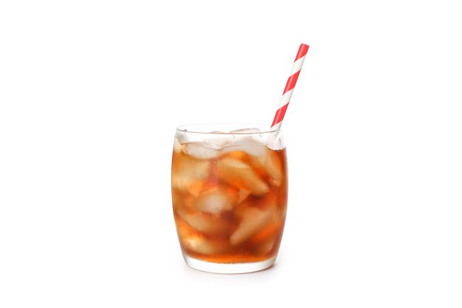Glass of cold cola isolated on blank background