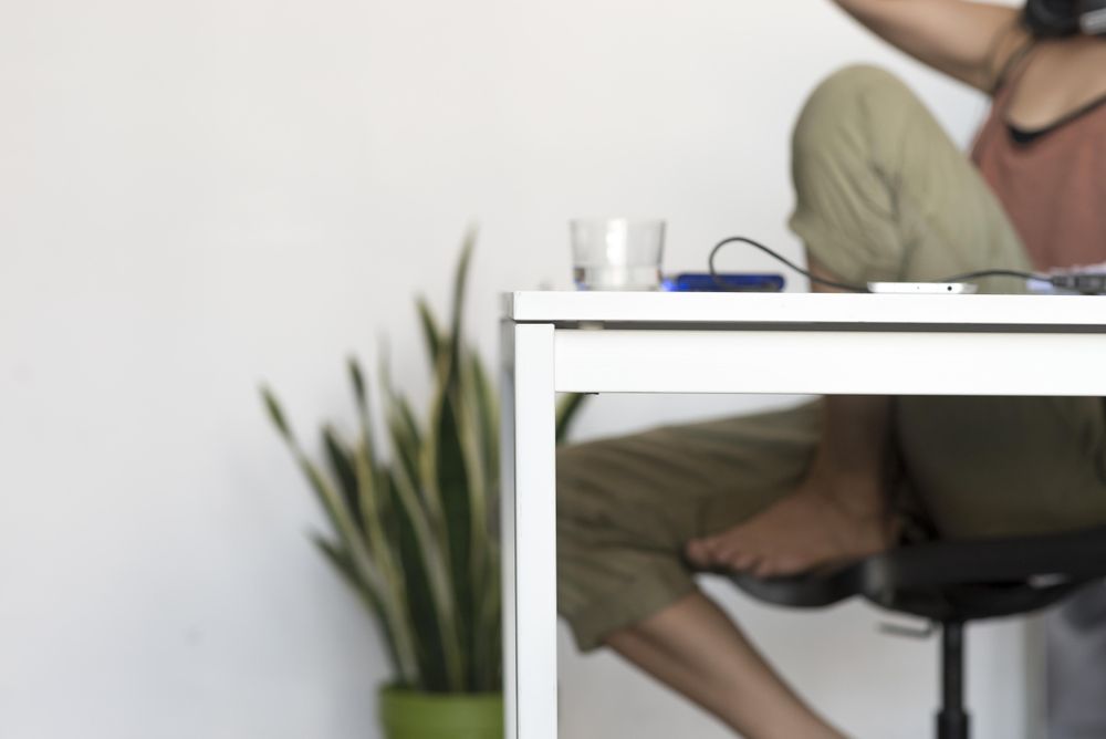 Office desk with woman in background