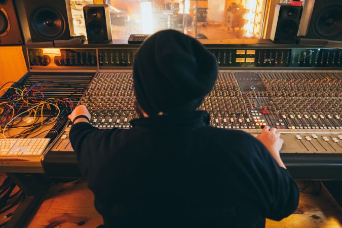 Man in a equalizer instrument in a studio