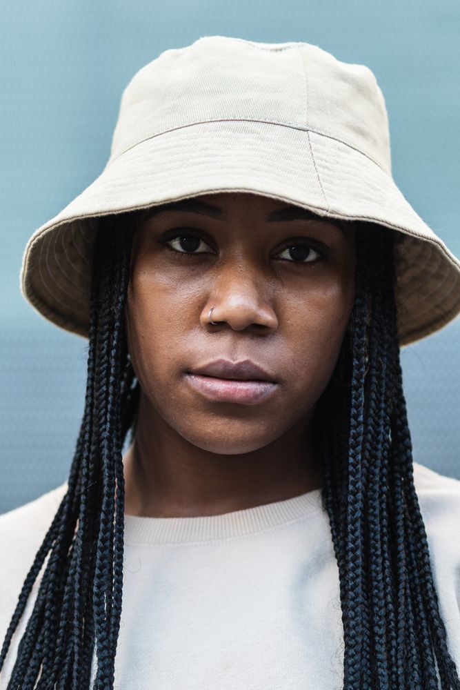 Young Black woman in hat