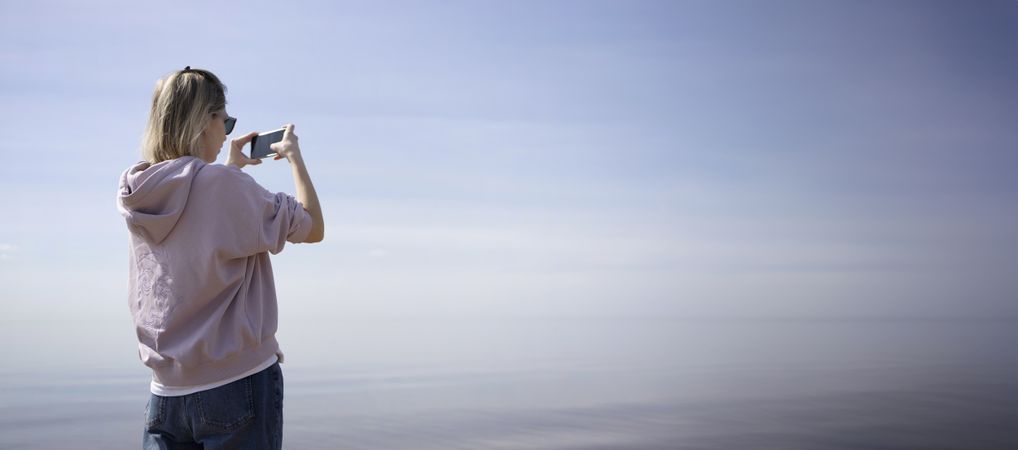 Woman Captures the Sea's Mirror Surface