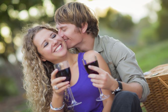 A Couple Enjoying A Glass Of Wine in the Park