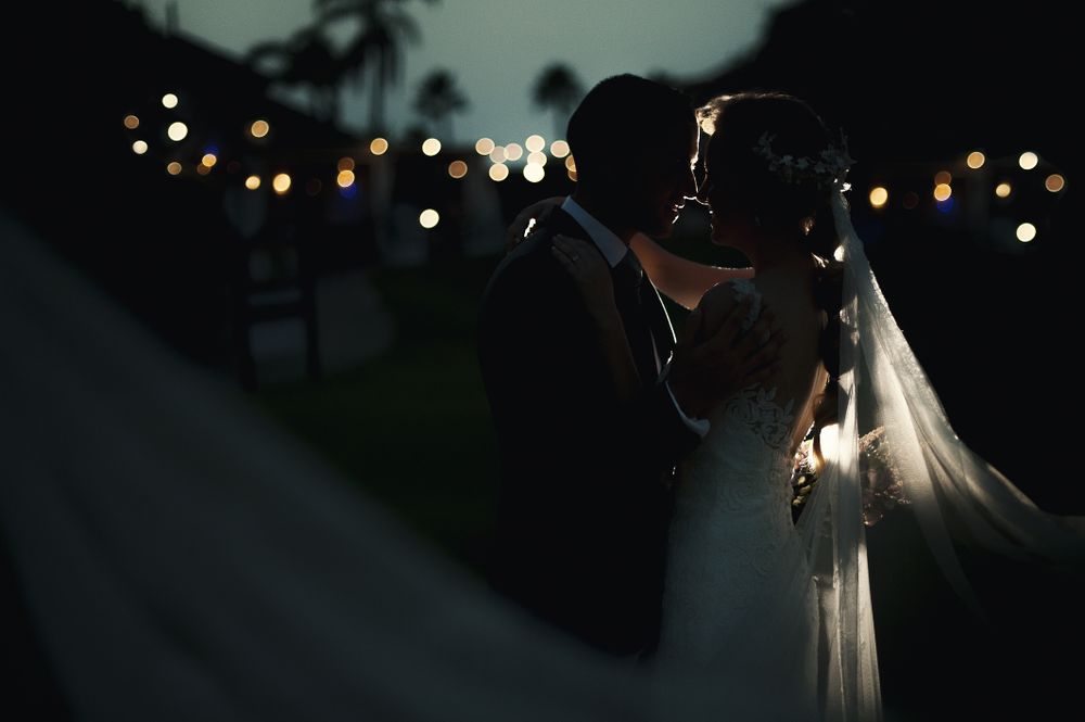 Marriage of woman and man embracing in darkness