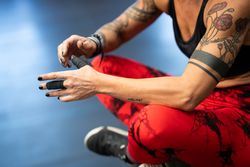Fit woman with fingers wrapped