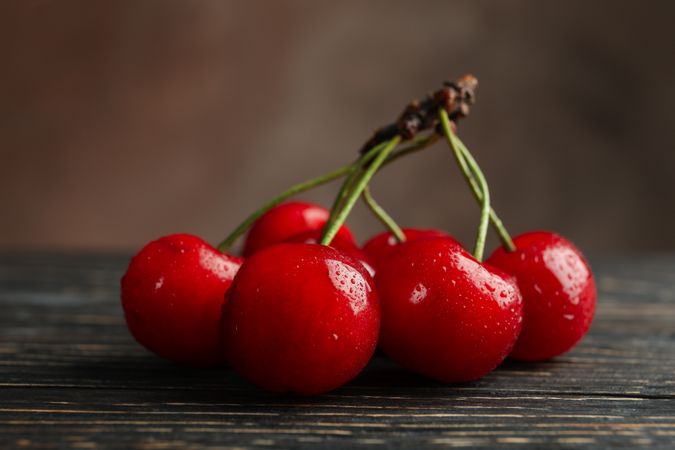 Fresh red cherry on wooden background, close up