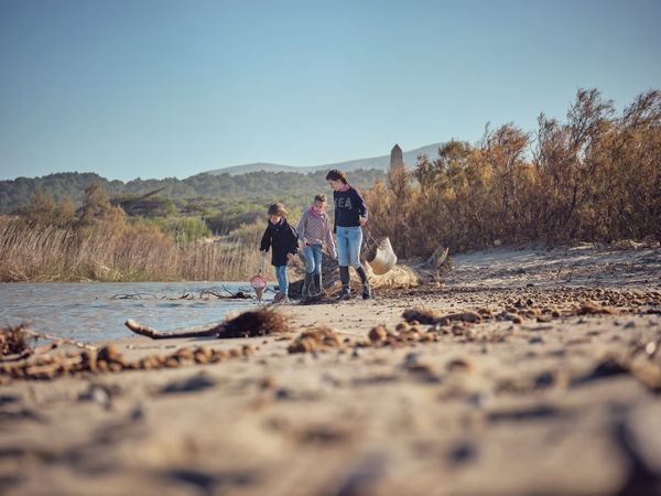 Teenagers activists seeking garbage and plastic waste in river s