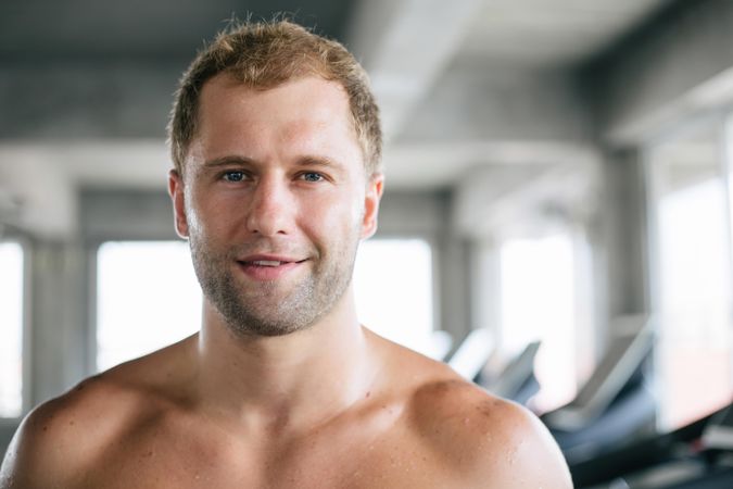 Blond male looking in camera in gym