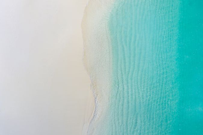 Aerial shot of clear water at the beach