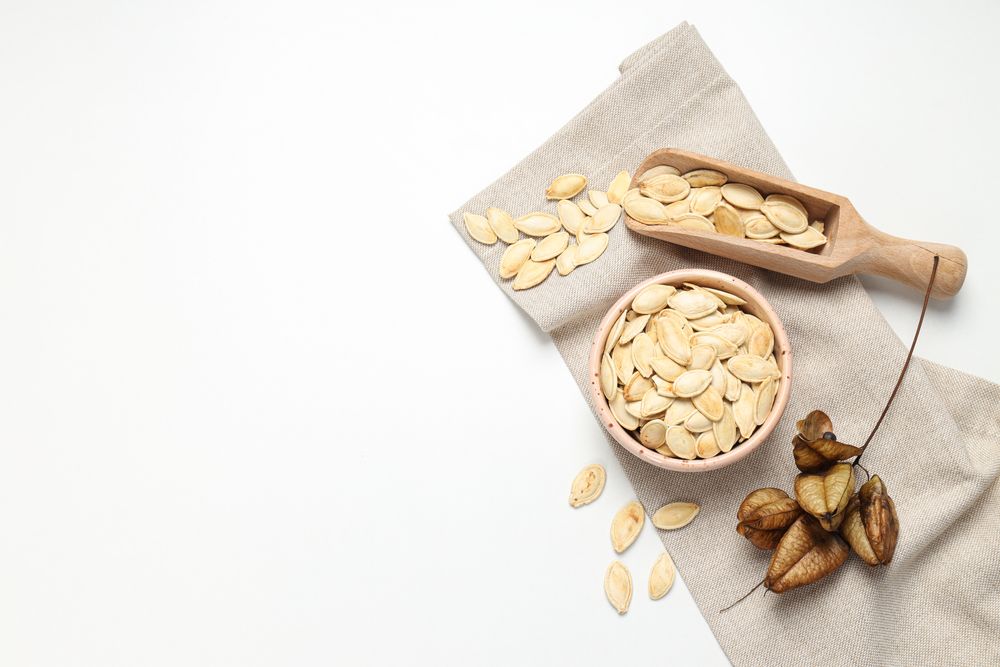 Cooking ingredients for fall season - pumpkin seeds, pumpkin