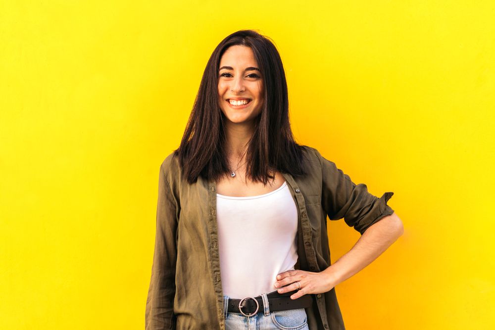 young woman portrait on a yellow background