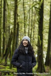Happy young woman in the woods looking up 5rEPn0