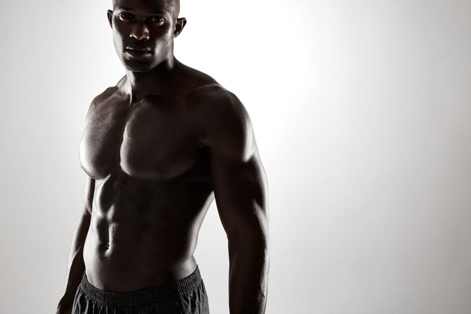 Cropped portrait of man with muscular physique