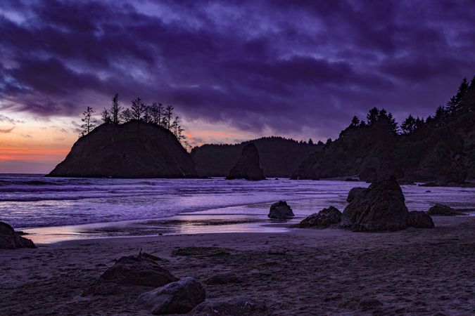 Beach at dusk with beautiful purple orange sky