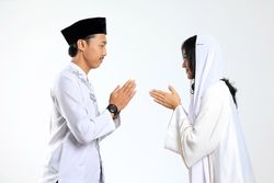 Asian Couple Forgiving Each Other by Giving Greets Hand During Eid Mubarak Celebration
