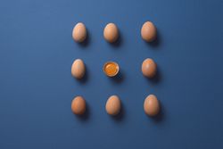 Whole eggs in perfect pattern with one cracked egg