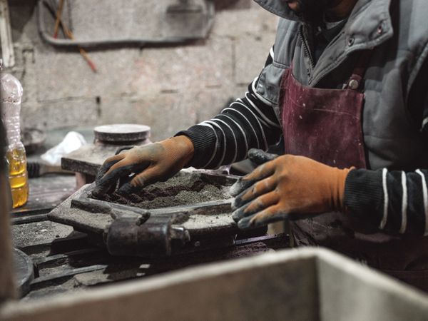 Crop artisan working with dry cement