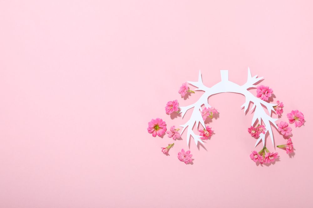 Paper lung bronchus with flowers with copy space