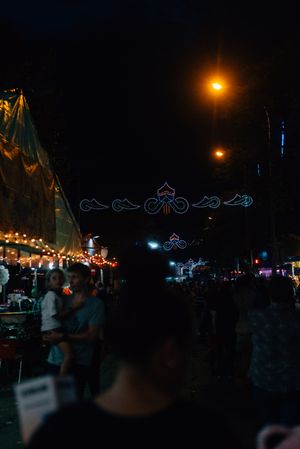 Glowing sign of amusement ride on fairground